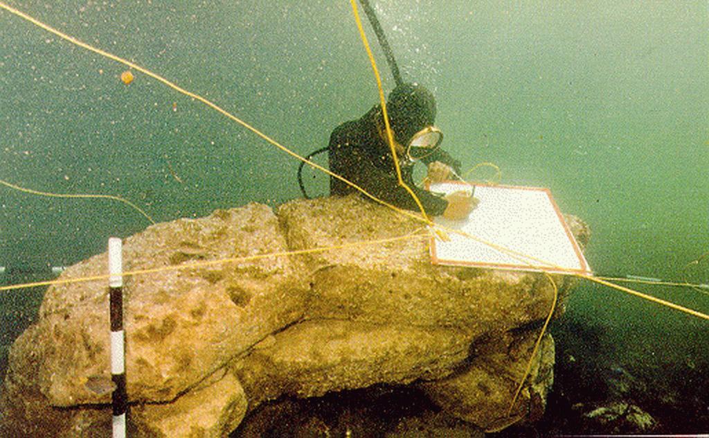 A diver documents dressed stone blocks on the seabed off Dwarka